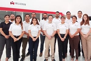 Several happy Milacron employees standing inside our North American office in Batavia, Ohio.